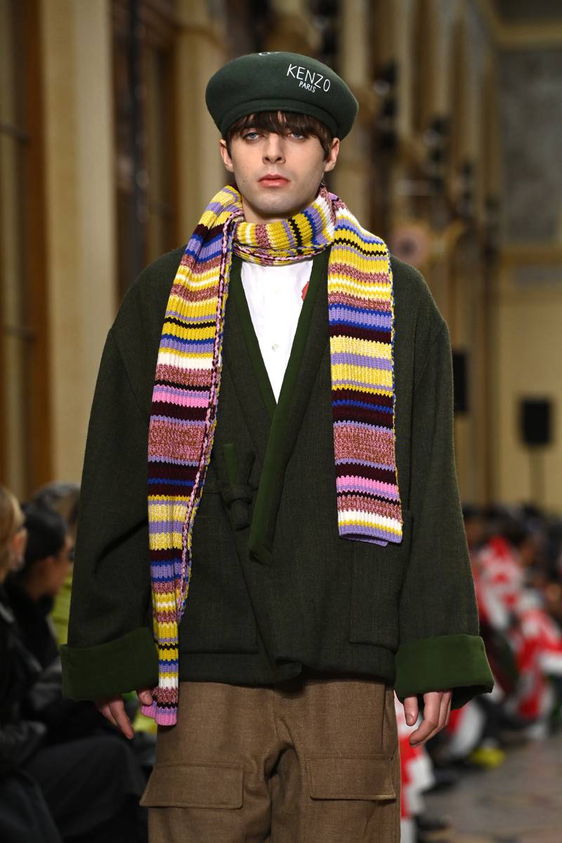 Nigo mixed a Japanese style jacket with a striped scarf at the Men's Paris Fashion Week show.