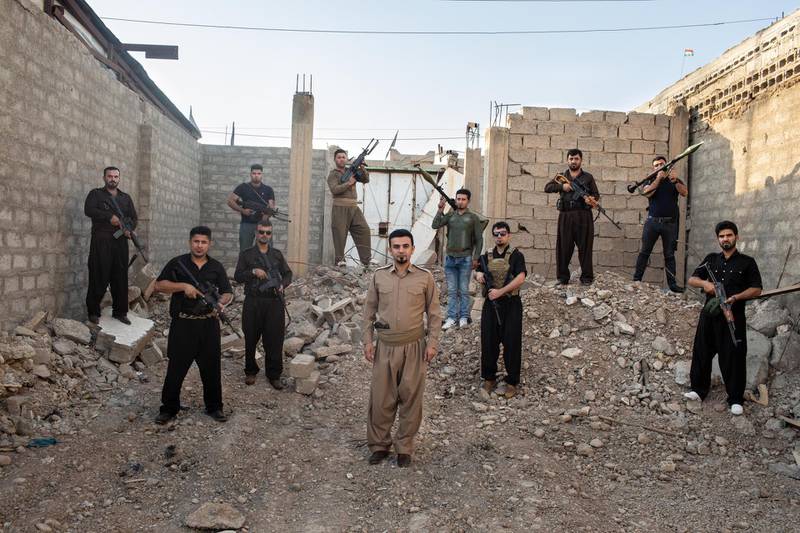 TUZ KHORMATU, IRAQ: Goran Gowhar, a Kurdish tribal leader, poses with his militia. Photo by Sebastian Meyer 