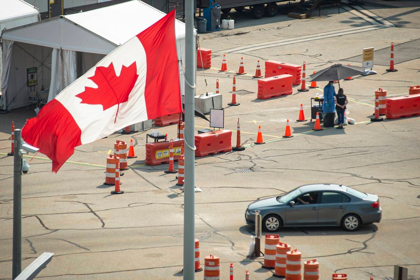 Car crosses the border into Canada in Niagara Falls, Ontario. The Canadian Press via AP