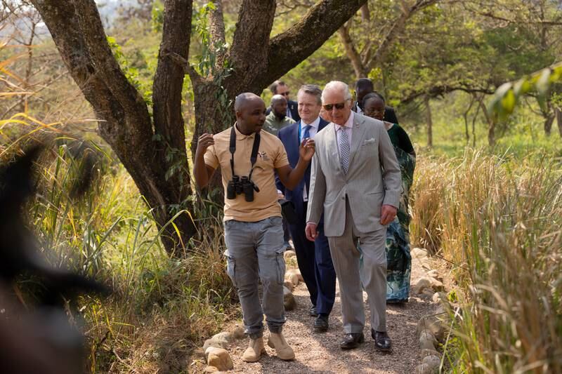 Prince Charles visits the village of Umusambi. He has criticised the asylum plan. EPA 