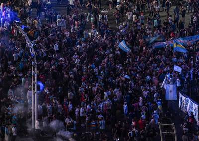 Fans gather at Obelisk of Buenos Aires to mourn and pay tribute to Maradona. Getty