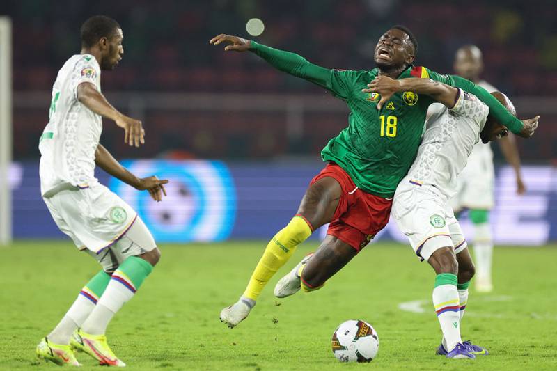 Cameroon midfielder Martin Hongla fights for the ball with Comoros midfielder Fouad Bachirou. AFP