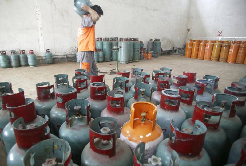 Liquefied petroleum gas cylinders in Foshan, Guangdong. LPG – propane or butane – is used for heating, cooking and in vehicles. Reuters