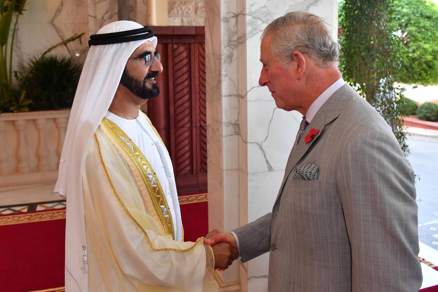 A handout picture taken by the Government of Dubai Media Office on November 8, 2016, shows UAE Prime Minister and Ruler of Dubai, Sheikh Mohammed bin Rashid al-Maktoum (L), shaking hands with Prince Charles of the United Kingdom (R) while on a three-day official visit to the Gulf country. (Photo by HO / GOVERNMENT OF DUBAI MEDIA OFFICE / AFP) / == RESTRICTED TO EDITORIAL USE - MANDATORY CREDIT "AFP PHOTO / HO / GOVERNMENT OF DUBAI MEDIA OFFICE" - NO MARKETING NO ADVERTISING CAMPAIGNS - DISTRIBUTED AS A SERVICE TO CLIENTS ==