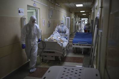 Medics transfer a Covid-19 patient at a hospital in Krasnodar, Russia. AP