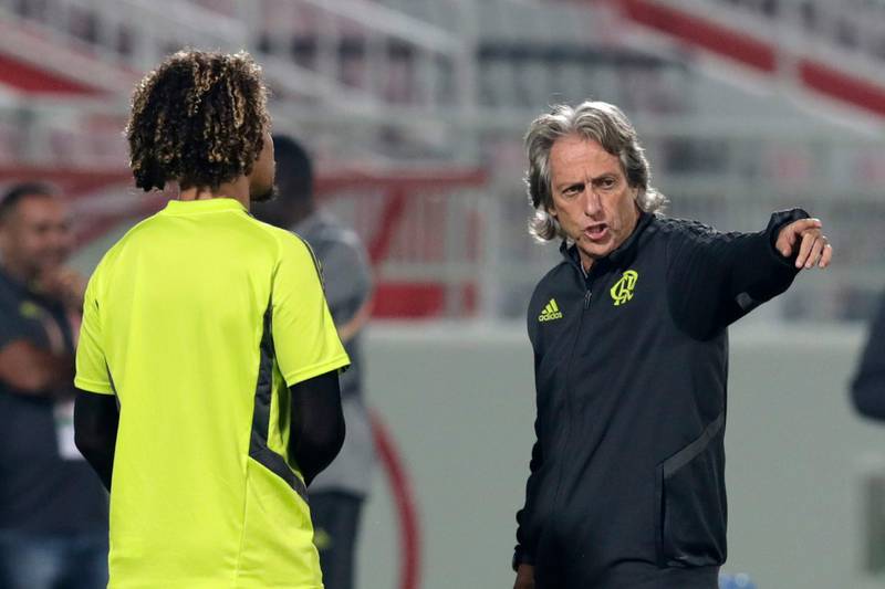 Jorge Jesus, right, speaks with Flamengo's Willian Arao during a training session in Doha. AP