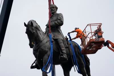 Crews remove one of America's largest remaining monuments to the Confederacy, a towering statue of Gen Robert E Lee on Monument Avenue, in Richmond. EPA
