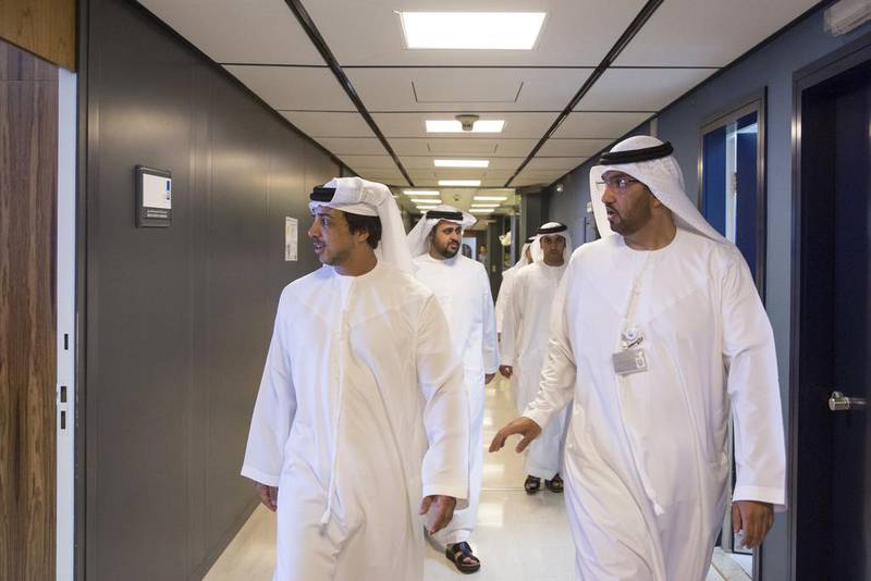 Adnoc Group chief executive Sultan Ahmed Al Jaber receives Sheikh Mansour bin Zayed Al Nahyan, left, Deputy Prime Minister and Minister of Presidential Affairs, and Sheikh Diab bin Mohamed bin Zayed Al Nahyan, back centre, during a visit to the company's headquarters. Ryan Carter / Crown Prince Court – Abu Dhabi