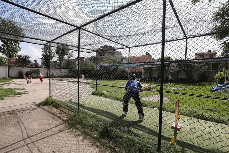 A cricketer participates in a nets session at the Baluwatar Cricket Club training centre in Kathmandu, Nepal. Pawan Singh / The National