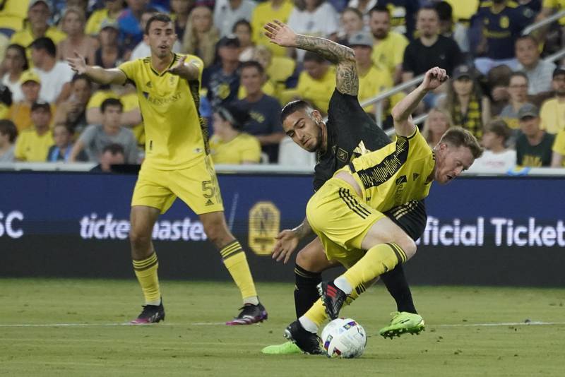 Nashville SC's Dax McCarty battles with LAFC's Cristian Arango during the first half of an MLS match. AP