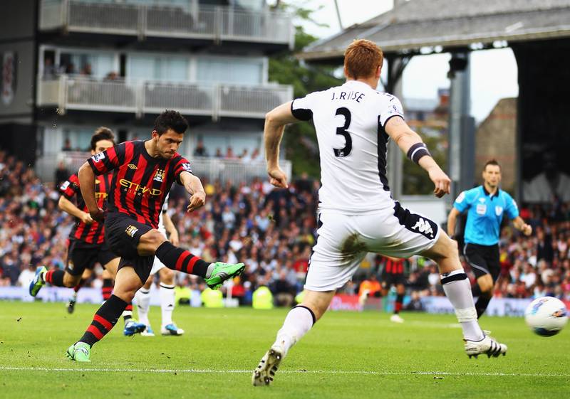 LONDON, ENGLAND - SEPTEMBER 18:  Sergio Aguero of Manchester City shoots and scores his sides second goal during the Barclays Premier League match between Fulham and Manchester City at Craven Cottage on September 18, 2011 in London, England.  (Photo by Julian Finney/Getty Images)