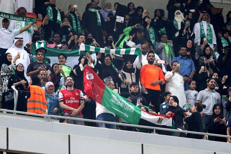 epa06434153 Saudi families cheer at the King Abdullah Sports City known as 'a radiant jewel' to attend the Saudi Football League soccer match Al Ahly and Al-Batin in Jeddah, Saudi Arabia, 12 January 2018. Saudi women for the first time are allowed to enter a sports stadium to watch a soccer match. They will be segregated from the male-only crowd with designated seating in the so-called 'family section'.  EPA/STR