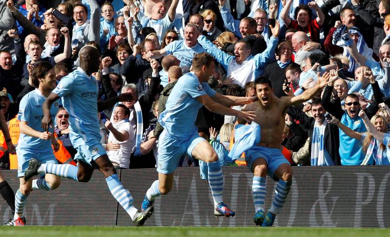 Manchester City's Sergio Aguero, right, celebrates his league-winning goal against Queens Park Rangers at the Etihad Stadium on May 13, 2012. Reuters