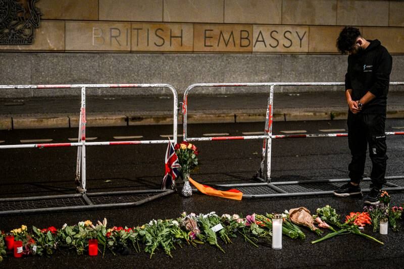 A man pays his respects in front of the British Embassy in Berlin, Germany. EPA