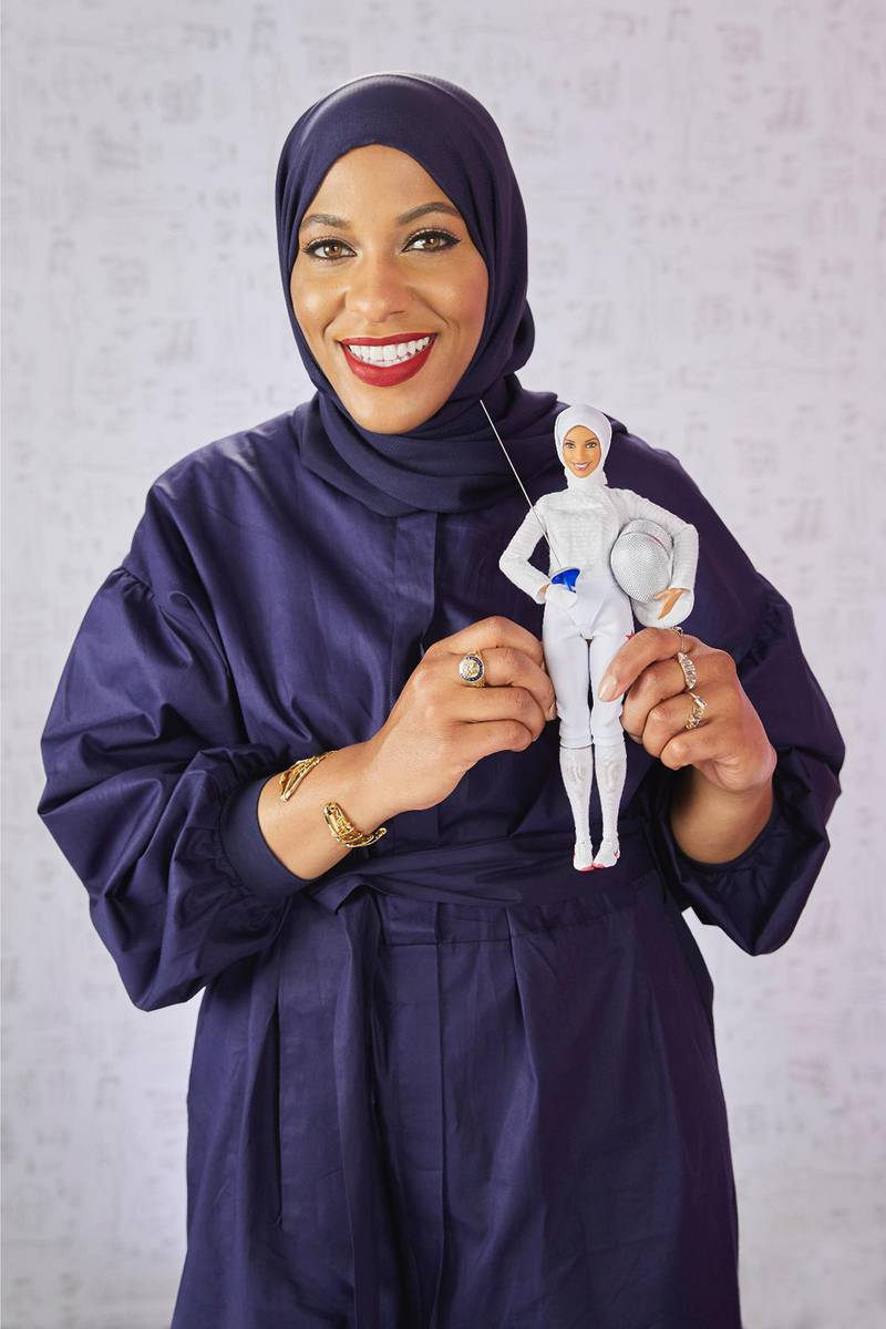 epa06328895 A handout photo made available by Mattel shows US Olympic fencer Ibtihaj Muhammad holding the first hijab-wearing Barbie based on her to be released in 2018, in New York City, New York, USA, 14 November 2017. The doll is part of the 'Shero' line of boundary-breaking women and will be available next fall.  EPA/MATTEL / HANDOUT  HANDOUT EDITORIAL USE ONLY/NO SALES
