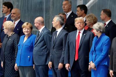 (LtoR) Lituania's President Dalia Grybauskaite, German Chancellor Angela Merkel, Belgium's Prime Minister Charles Michel, NATO Secretary General Jens Stoltenberg, US President Donald Trump and Britain's Prime Minister Theresa May attend the opening ceremony of the NATO (North Atlantic Treaty Organization) summit, at the NATO headquarters in Brussels, on July 11, 2018.  / AFP / GEOFFROY VAN DER HASSELT
