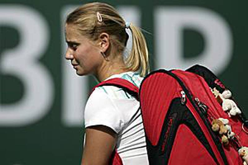 Jelena Dokic exits the court in dismay after losing in straight sets in her first round match of the BNP Paribas Open to Jill Craybas.