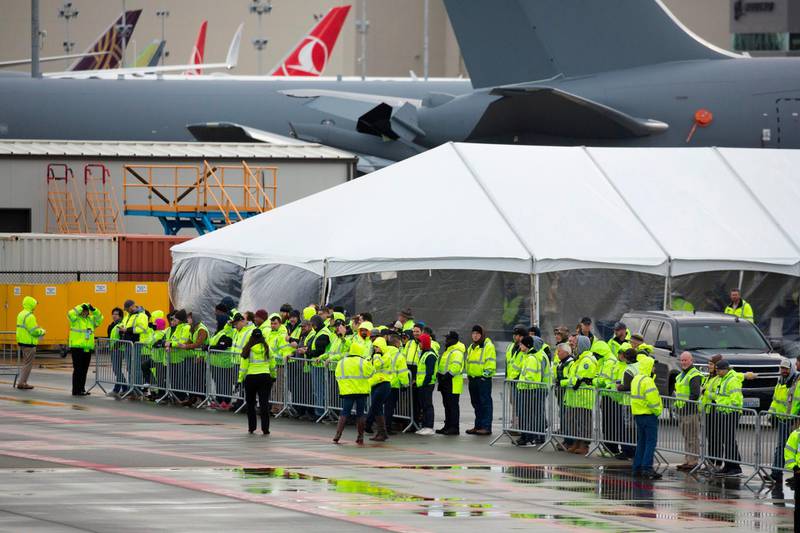 Boeing workers attend a first flight event for the 777X airplane, which had to be rescheduled due to weather, at Paine Field in Everett, Washington on January 24, 2020. AFP