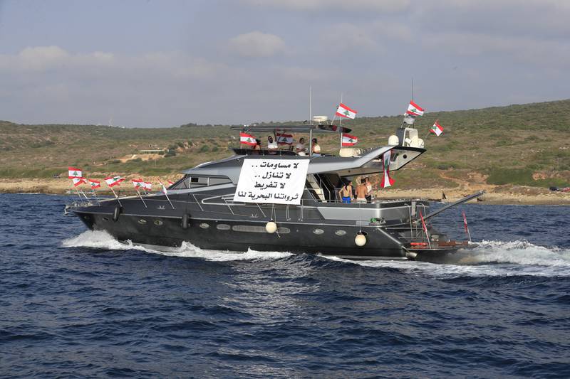 The banner on the Lebanese protesters' yacht reads: 'No compromises. No waivers. No negligence. Our maritime resources belong to us.' AP Photo