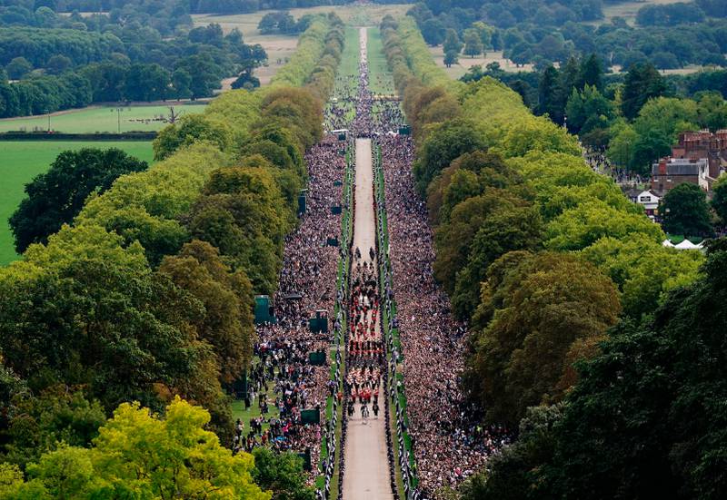 On Monday, the UK came to a standstill as the state funeral of Queen Elizabeth II took place. Here, the ceremonial procession of the coffin travels down the Long Walk at Windsor Castle. AP