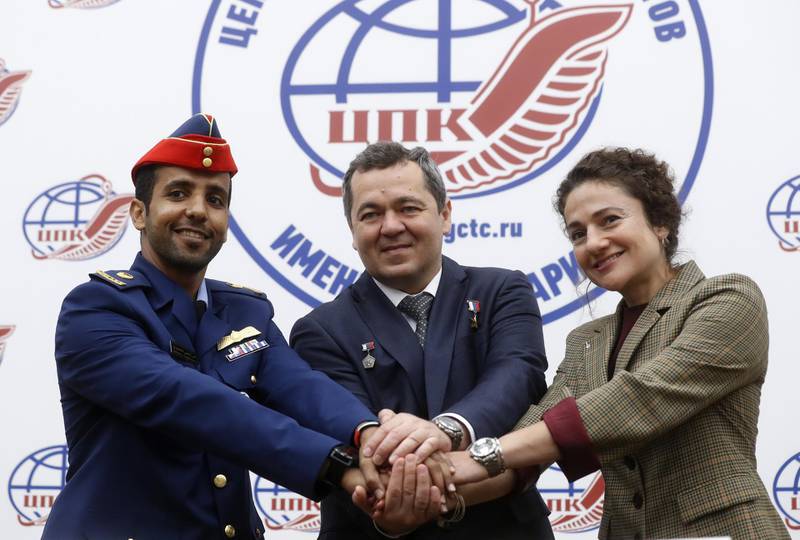 epa07818699 (L-R) Members of the International Space Station (ISS) expedition 61/62, UAE astronaut Hazza Al Mansouri Emirati, Roscosmos cosmonaut Oleg Skripochka and NASA astronaut Jessica Meir attend a joint press conference at the Russian cosmonaut training center in Star City outside Moscow, Russia, 05 September 2019. Mansouri will be the first Emirati in space. The launch of the mission of UAE astronaut Hazza Al Mansouri, Roscosmos cosmonaut Oleg Skripochka and NASA astronaut Jessica Meir is scheduled on 25 September from the Baikonur Cosmodrome in Kazakhstan.  EPA/MAXIM SHIPENKOV