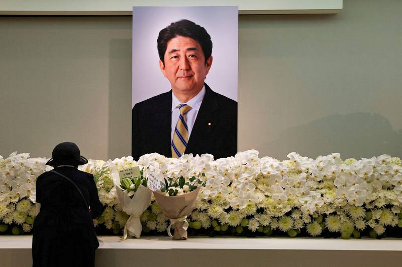 A mourner in Taipei in Taiwan pays respects to former Japanese prime minister Shinzo Abe, who was assassinated while campaigning in parliamentary elections. Reuters