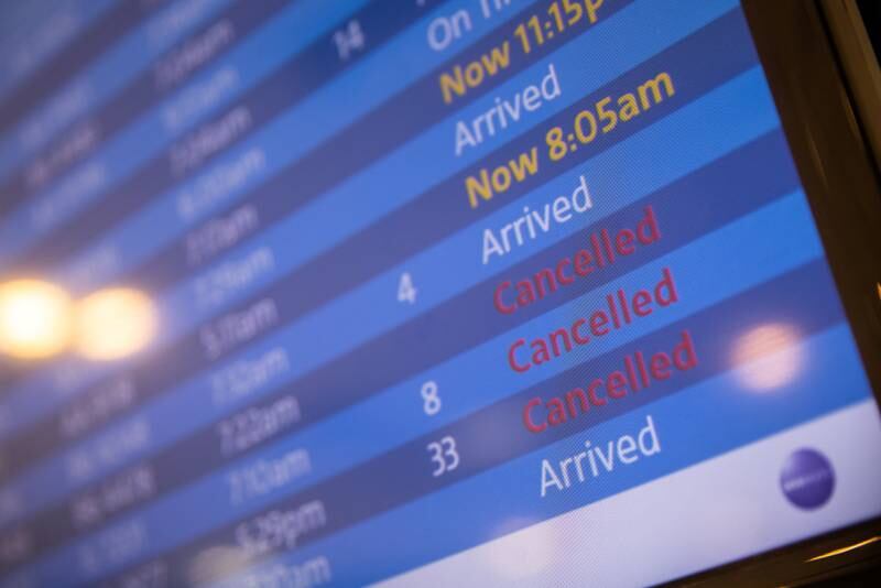 Poor weather conditions and a staffing crisis caused by Covid-19 cancelled thousands of flights at the weekend. Reuters