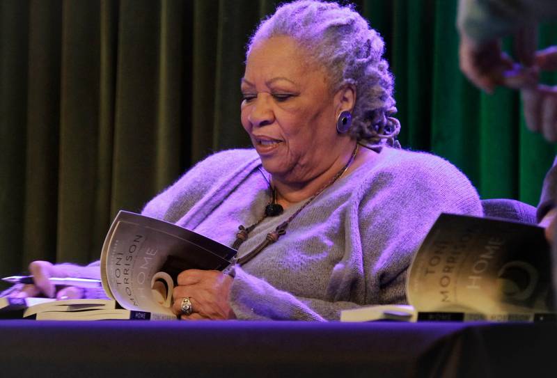 Toni Morrison signs copies of her book 'Home,' during Google's online program series, Authors At Google, in New York, in 2013. AP Photo