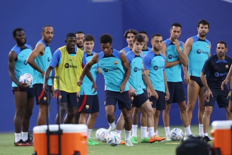 Barcelona players warm up during a training session. Getty