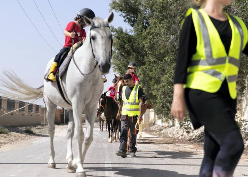 ABU DHABI, UNITED ARAB EMIRATES. 18 MARCH 2020.Children riding horses in Al Samha with Ride to Rescue project.Yasmin Sayyed runs Ride to Rescue. She has taken in 17 rescued horses who would normally be euthanized, and she tries to offset the cost of their care by offering the public healing sessions where they ride or walk with them. (Photo: Reem Mohammed/The National)Reporter:Section: