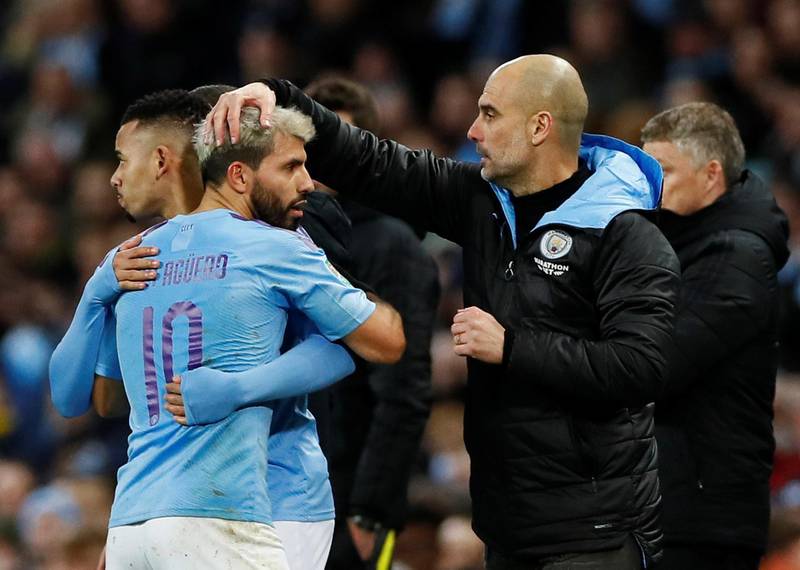 Manchester City's Sergio Aguero with manager Pep Guardiola as he was substituted for Gabriel Jesus. Reuters
