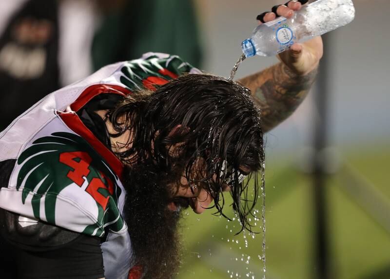 Eagles' Charles Vallace cools offduring the match.