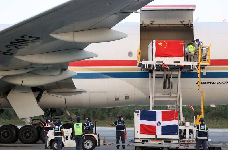 Airport operators unload a batch of Sinovac Covid-19  vaccine at the Santo Domingo International Airport, Dominican Republic. EPA