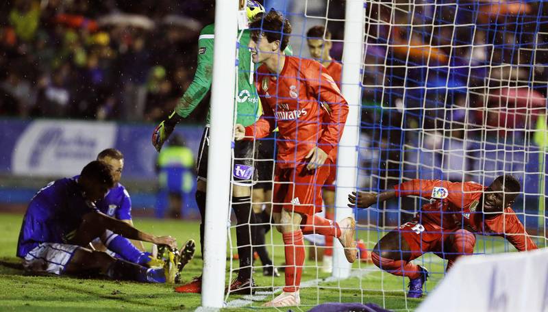 Real Madrid's Alvaro Odriozola (centre) celebrates after scoring during the Spanish King's Cup fourth round match. EPA