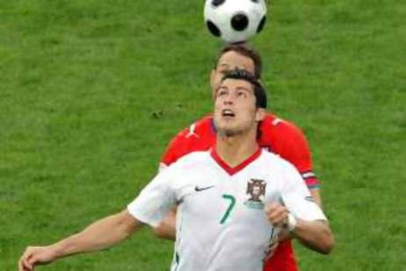 Portugal's Cristiano Ronaldo, left, and Czech Republic's Tomas Sivok vie for the ball during the group A match between Czech Republic and Portugal in Geneva, Switzerland, Wednesday, June 11, 2008, at the Euro 2008 European Soccer Championships in Austria and Switzerland. Portugal defeated Czech Republic 3-1. (AP Photo/Niklas Larsson)