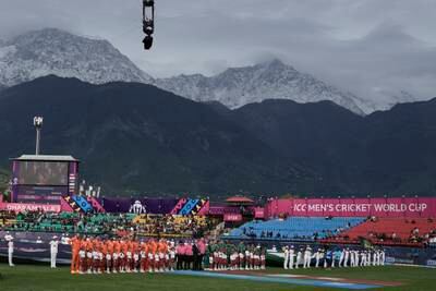 The Dhauladhar range is covered with fresh snow as the Netherlands and South Africa stand for their national anthems before their Men's Cricket World Cup match in Dharamshala, India. AP