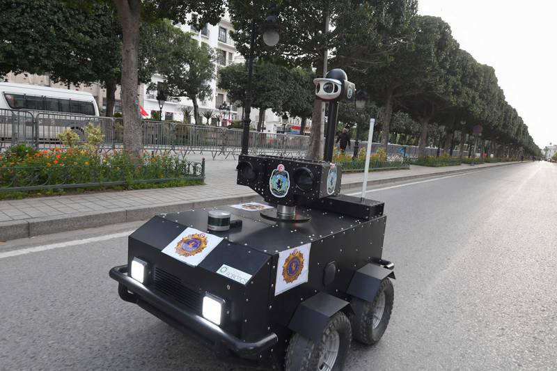 A Tunisian police robot patrols along Avenue Habib Bourguiba in the centre of the capital Tunis, as a means of enforcing a nationwide lockdown to combat the coronavirus pandemic.  AFP