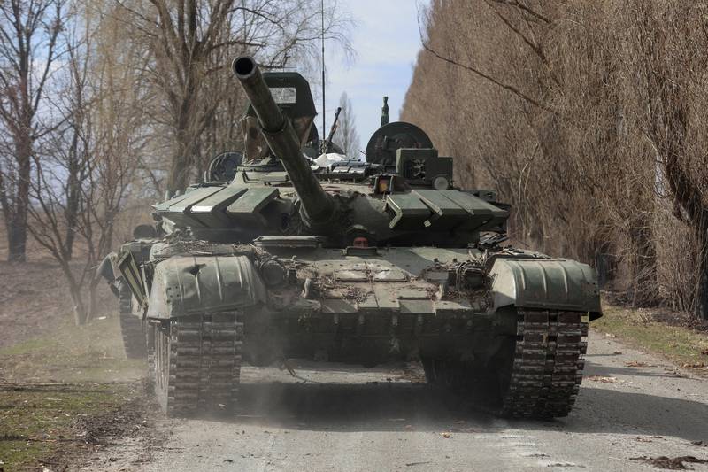 A Ukrainian service member drives a captured Russian T-72 tank in late March. More have been sent to help Ukraine. Reuters