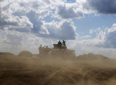 Ukrainian troops with an armoured vehicle near Debaltseve, in the eastern Donetsk region, on August 29, 2014. Gleb Garanich  / Reuters