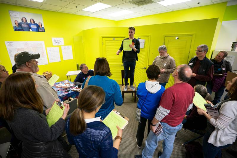 Joe Stuever, a volunteer for Democratic Kansas House candidate Sharice Davids, enlists volunteers to canvass for her at Davids' Johnson County Field Office in Overland Park, Kansas. EPA