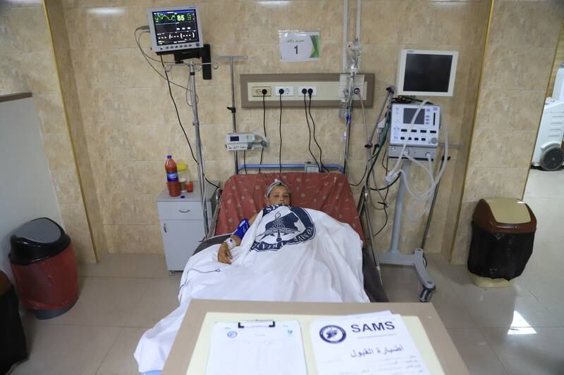 Mahmoud, connected to medical devices in SAMS hospital.