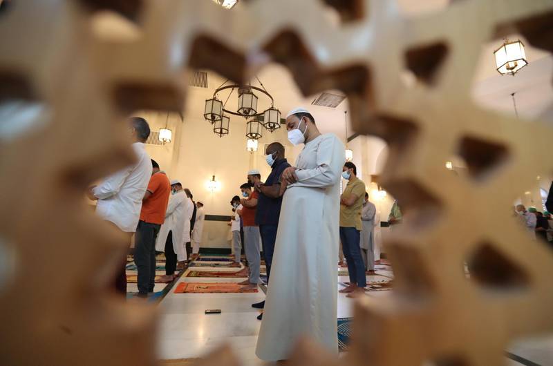 Men attend Friday prayers during the second Friday of Ramadan in Dubai. EPA