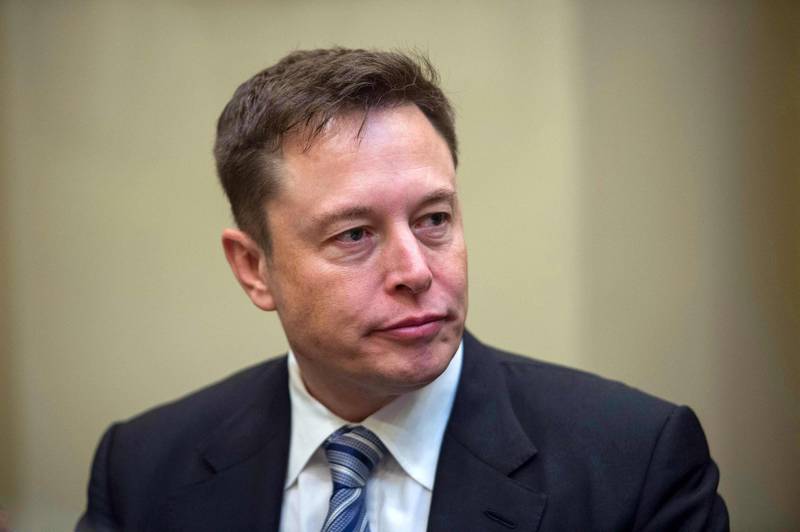 (FILES) In this file photo taken on January 23, 2017 CEO Elon Musk listens to US President Donald Trump speak during a meeting with business leaders in the Roosevelt Room at the White House in Washington, DC. - Tesla Motors dropped in early trading on August 20, 2018 due to rising doubts about Chief Executive Elon Musk's plans to take the electric carmaker private. Shares fell 2.6 percent to $297.55 about 20 minutes into trading, continuing the company's downward trajectory after Musk surprised markets on August 7 by announcing on Twitter he wanted to take Tesla private. (Photo by NICHOLAS KAMM / AFP)