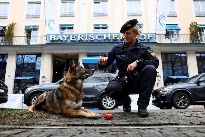 Police dog Basco searches the area outside the Bayerischer Hof hotel, before the start of the conference. Reuters