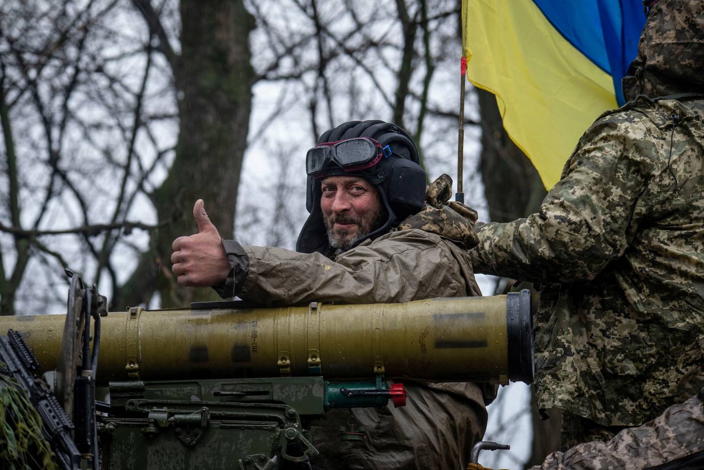 A Ukrainian serviceman on board an armoured vehicle in eastern Ukraine.  Reuters