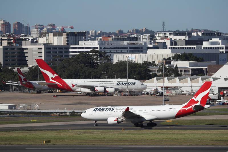 FILE PHOTO: Qantas planes are seen at Kingsford Smith International Airport in Sydney, Australia, March 18, 2020. REUTERS/Loren Elliott/File Photo