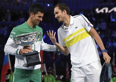Novak Djokovic and Daniil Medvedev after the trophy presentation. AP