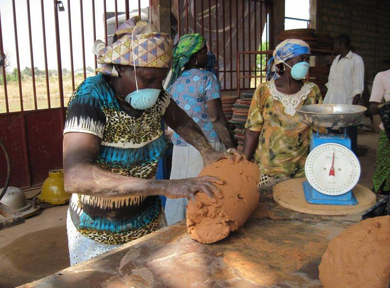 Workers at the Pure Home Water factory in Tamale, Ghana at work making a ceramic pot water filter out of clay and rice husk. Courtesy  Pure Home Water 