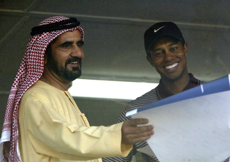 DUBAI, UNITED ARAB EMIRATES - MARCH 7:  His Highness Sheikh Mohammed Bin Rashid Al Maktoom, UAE Minster of Defence and Crown Prince of Dubai meets with Tiger Woods of the USA after the 2004 Dubai Desert Classic played on the Majilis Course at the Emirates Golf Club on March 7, 2004 in Dubai, United Arab Emirates.  (Photo by Warren Little/Getty Images)