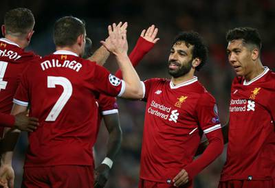 Liverpool's Mohamed Salah celebrates with his teammates after their third goal. Dave Thompson / AP Photo